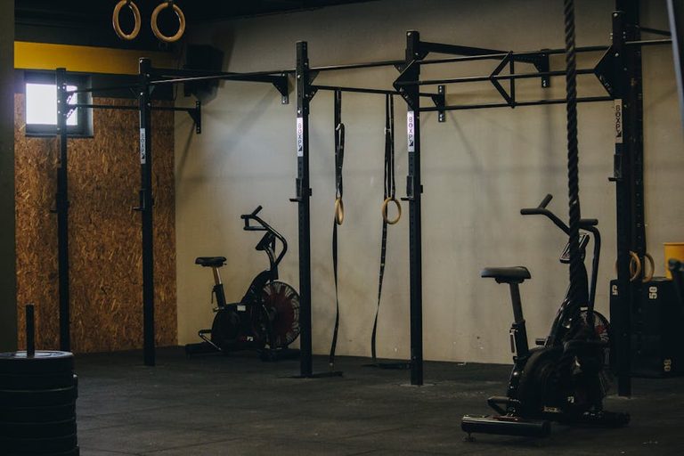 industrial-style-gym-with-exercise-bikes-rings-and-pull-up-b
